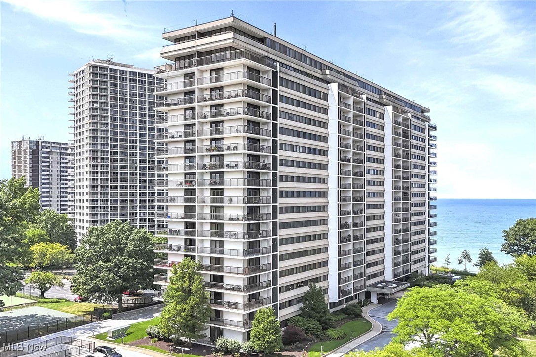 Large, 2 bedroom, 2 bath SW corner suite in The Meridian. At almost 1400 sf, it is one of the largest 2 bedroom suites in the building and on The Gold Coast. The wrap around balcony offers an additional 275 sf of outdoor living space with spectacular sunsets, lake views and tree top views of Lakewood. Fresh and bright! Newer, neutral carpeting (2020) and quality window treatments (2022). Kitchen is well equipped with ample counter and storage space, a breakfast bar and all appliances. There is an additional closet/pantry just outside the kitchen, as well. Ample storage space throughout including walk in closets in bedrooms. Storage locker is located on garage level. Assigned two parking spaces (#74 - tandem) in underground garage. 24-hour front desk assistance. Amenities galore including indoor and outdoor pools, sauna, hot tub and grilling/picnic areas. Convenient laundry rooms on every floor. Close to Airport, University Circle and all things Lakewood.
