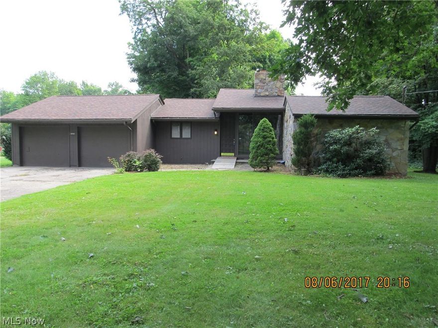 A truly a one of a kind custom ranch home with 2 bedrooms, 2.5 baths, first floor laundry, and more!  Enter the front door to an open & spacious living room with vaulted ceiling, and floor to ceiling stone fireplace & windows. Large eat in kitchen with new countertops, stove, fridge, microwave, and dishwasher all stay. Enjoy the serene wooded landscapes & your morning coffee from the 3 season room with access to the back patio & catwalk.  The first floor laundry/mud room can be entered from the 2 car attached garage or the back patio.  The master bedroom suite has it's own private master bath and 2 walk in closets. The other bedroom is big & roomy too. There is a partially finished family room in the basement with a 1/2 bath.  The basement has a doorway walk out to a deep storage garage underneath the home & access to back yard. So much extra space to store the things that matter. In the last 2 years the home has new carpet in the bedrooms, fresh paint, a new high efficiency furnace, n