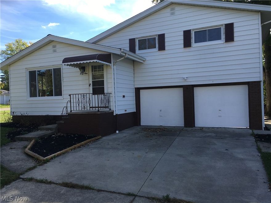 Move In Right Now!!! New everything, furnace, hot water tank, electrical, windows, carpet, kitchen and baths.Spacious finish basement.  Beautiful inside and out, nice lot! Kitchen has new cabinets,  flooring and granite counters, glass block windows.  Range and dishwasher is included. New windows, carpet just everything come and see!!!