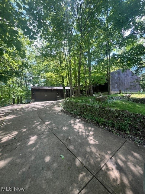 Ranch with updated Kitchen, cathedral ceilings in Kitchen, Living Room, Family Room, and Sunroom. Layout flows nicely with three separate social zones on main level. Private heavily wooded corner lot. Side and back porch. Full basement. Well built home.