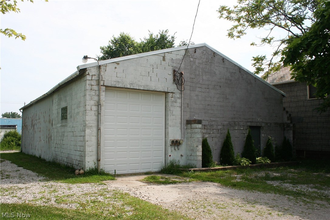 2,400 square foot garage/warehouse(40 x 60) with 10 x 14 ft overhead door (can accept a semi rig). Zoned L 1, light industrial. 2 parcels equaling .33 acres, one parcel includes the building the other is a vacant lot. The building includes compressor with access throughout the building via a loop. Also electric service is currently 100 amp single phase.