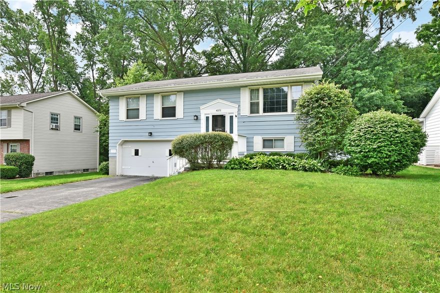 Spacious and move in ready bi level home in a beautiful neighborhood in Boardman school district! Close to shopping, dining and Mill Creek Park. Main level welcomes you with an open concept floor plan, beautiful laminate wood floors and custom woodwork! Large living room opens to a dining room addition overlooking the private fenced in back yard! Lots of room to work in the updated kitchen with stainless steel appliance package. 3 bedrooms upstairs and a renovated main bath. The lower level is perfect for a master suite! Featuring a bathroom/storage area, family room/sitting area, laundry area with custom closet and a large bedroom area with sliders to the back deck. 2 car attached garage with plenty of room for extra  storage.