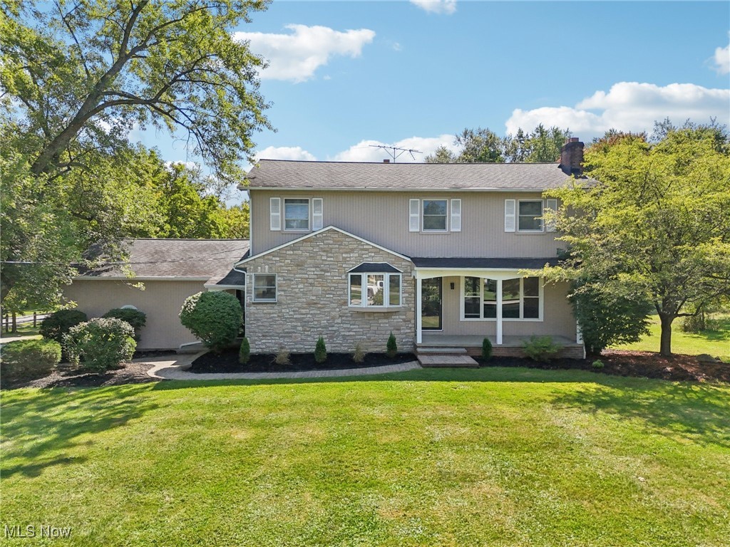 Welcome to Your Dream Colonial in Solon. Step into modern elegance with this completely remodeled Solon colonial. From the moment you enter, you’re greeted by a spacious living room that flows seamlessly into a stunning eat-in kitchen featuring Samsung stainless steel appliances, quartz countertops, sleek ceramic backsplash, and stylish lighting. Durable stone-core plank flooring runs throughout, tying together every detail. The main floor offers a spacious great room with sliders to brand-new composite decking, a versatile bedroom, and two fully remodeled powder rooms. Step outside to your backyard oasis, complete with a pool-ready yard and a three-season porch with its own powder room and built-in food prep station—perfect for entertaining. Upstairs, retreat to your owner’s suite with a walk-in closet featuring a custom organization system and a luxurious en suite bath with heated floors and private balcony overlooking the pool yard. Two additional bedrooms, a large closet and an updated hall bath complete the second floor. The partially finished basement is designed for relaxation and fun, boasting a fireplace, spacious bar, and beverage refrigerator—ideal for hosting friends and family. Nestled on a private corner lot, this move-in-ready home offers both style and comfort. All that’s left is for you to make it yours.