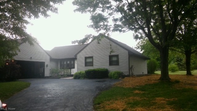 Clean 3 BR, 2 BA Ranch home with loads of improvements. Situated on 1 plus acres, This home is in MOVE IN pristine condition. Please see list attached dating everything from the roof, windows, appliances, furnaces etc...Entire home has been meticulously maintained. If your search includes a spacious yard in a quiet country area with a spacious eat-in-kitchen with gorgeous cabinetry, built in cook top and oven. Conveniences off first floor laundry, nice attached garage and full basement with workshop. Three bedrooms on first floor and his and her closets and full bath in the master bedroom. Nice dining room and a huge living room with fireplace leading to a screened in patio and private deck. Then this is your home.
