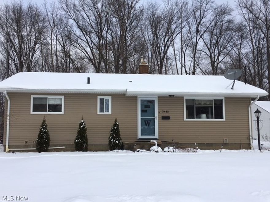 Amazing space in Mogadore!  This 3 bedroom ranch offers all you need and more.  With 2 full bathrooms, living room, eat-in kitchen, huge open living area, family room and 4th bedroom in the basement.  When you walk in the front door you will love the beautiful original hardwood floors.  The living room opens into the kitchen with all appliances included.  Down the hall you will find 3 bedrooms, all with hardwood floors and the main floor bathroom.  New Bath Fitter surround (with lifetime warranty), linen closet, newer vinyl flooring, updated lighting and new toilet.  But that's not all..  The lower level has so much space with 5 extra rooms and a full bathroom!  Bathroom has a new toilet, nice vanity and shower.  There are glass block windows, 2 year old hot water tank, 7 year old furnace, sump pump and so much storage.  New roof and siding 2007, updated windows, blown in insulation 5 years ago, new storm door and ceiling fans throughout.  You can't forget the huge 24x30 2.5 car garage
