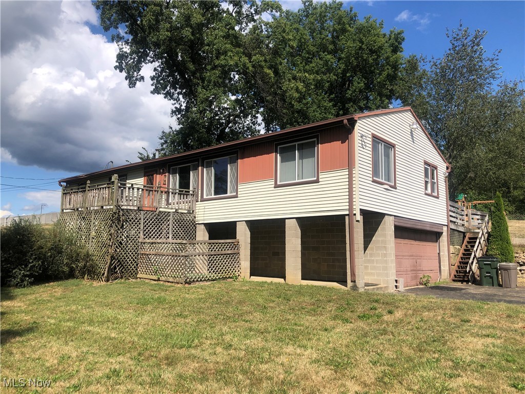 Fixer upper 3 bedroom raised ranch with an oversized 2 car attached garage and a nice detached 30 x 30 outbuilding sitting on a 1 acre lot in Plain Twp. The main level has a large living room with a door leading to a private deck, a kitchen having a tile floor with a door leading to a huge deck overlooking the fenced in back yard and a formal dining room with hardwood floors. There is a primary bedroom with a walk in closet, 2 more ample sized bedrooms, a full bathroom with tub/shower and a bonus room at the top of the stairs that would make a nice home office. The walk out basement has laundry hook ups and offers plenty of room for storage. Other features include an oversized attached garage, a 30 x 30 outbuilding with electric, a blacktop driveway, a huge deck in the fenced in back yard, a gas forced air furnace, A/C, and vinyl replacement windows. Property is being sold "as is" and with a little TLC it has much to offer. Stark County Auditor has it as a 2 bedroom but there are 3 bedrooms.