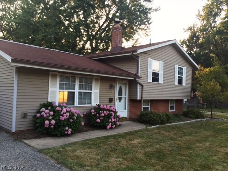 Enjoy living 3 houses from beautiful Lake Erie! Deep fenced in back yard with small glimpse of the lake. Mentor Beach Park & playground is in walking distance to enjoy cook outs and sunsets. This is a  3 possible 4 bedroom split level home with 1.5 baths on 0.32 acre. This home has beautiful ceramic flooring in the family room, kitchen, dining room, foyer and laundry room. Living room is wood and hardwood is under the 3 carpeted bedroom floors. Neutral colors and open floor plan adds to this desirable home. A detached 2 car garage and storage shed is in the back yard. New sump pump recently installed. Call to View this beauty, immediate occupancy.