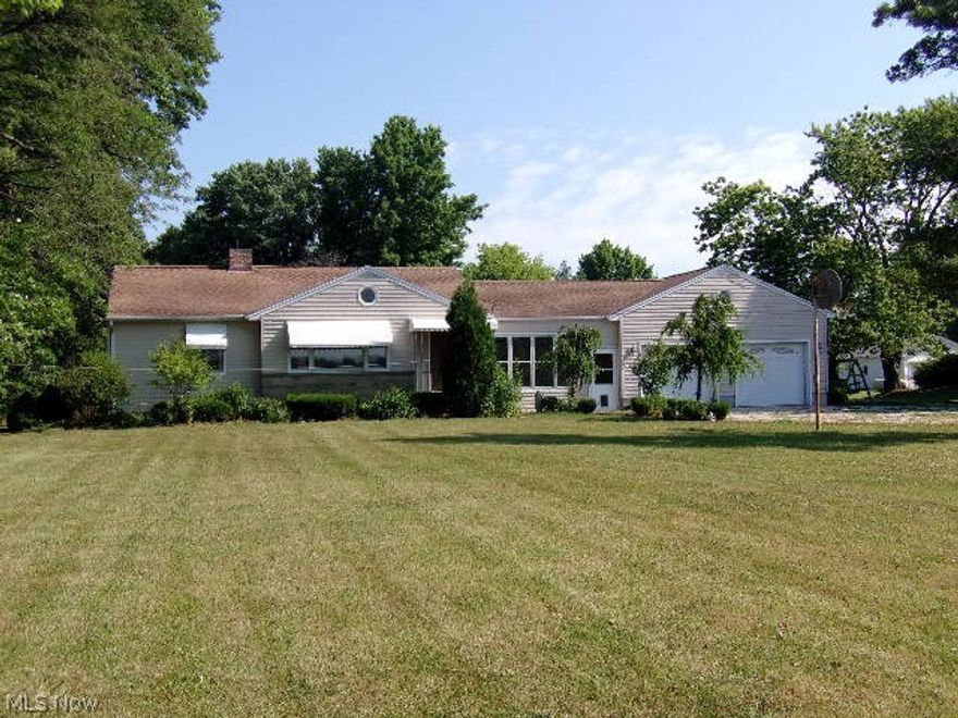 Great country property in "move-in" condition/  Many quality updates/ Custom built cherry cabinets and ceramic floors in kitchen-appliances included/ Spacious living room with oak floors and built-in's/ 3 bedrooms all with oak flooring/ Cedar lined closets/ 2 very nice bathrooms/ Basement has fireplace with built-in woodburner/ Built-in cabinets and counters in basement/ Second bathroom and mud room have ceramic tile/ Main bath has marble flooring/ Enclosed sun-porch with new carpeting/ Attached 2-car garage and detached 30 x 60  garage with cement floor and electric!