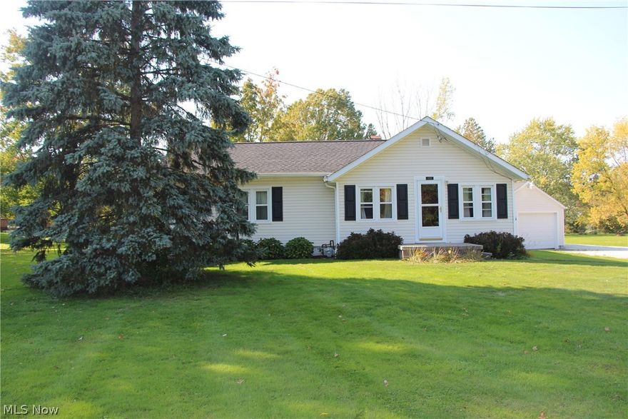 Charming home on a large lot in Rootstown Township!  This property began as the Rootstown post office but has been transformed into a great home with additions including a newer separate two car garage behind the first single car garage.  The roof is newer as well as the siding and freshly graveled wide driveway.  There is a lot of potential in this home that is ready for it's next owners!