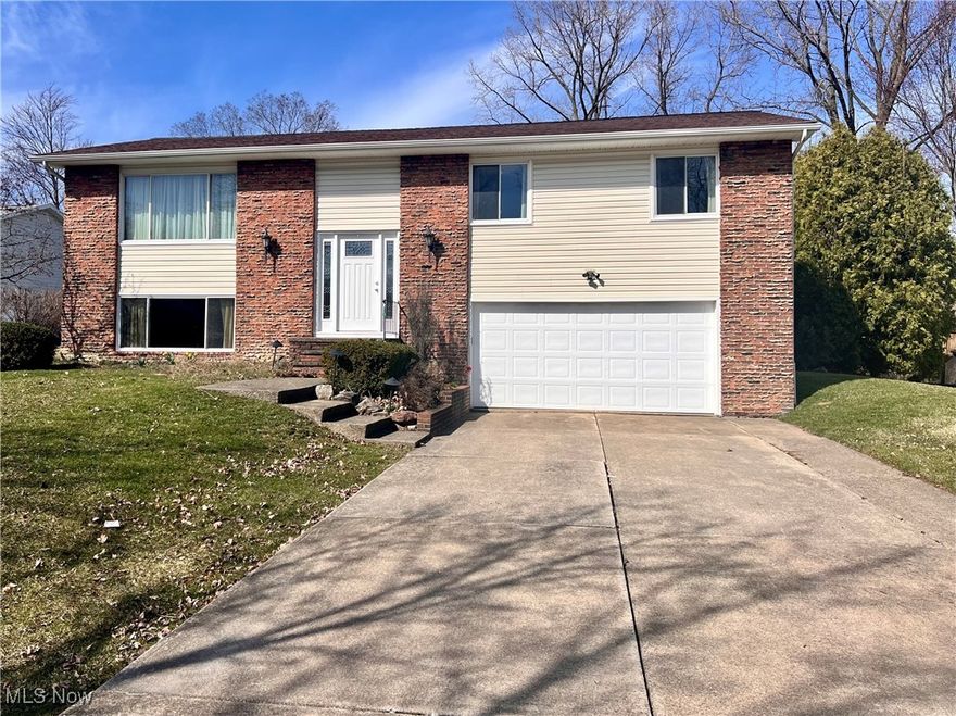 Welcome home to this charming 3 bed, 2 bath Bi-level home that Carol Brady would absolutely adore! The moment you step through the front door, you'll be greeted with a beautiful 2 story entrance featuring wright iron stair rails leading to the living room, creating a welcoming atmosphere. The home boasts soaring ceilings with exposed beams, enhancing the open and airy feel of the space, perfect for family gatherings and entertaining. The lower level is truly a standout feature, with tons of space and 1/2 bath that Carol would love. It's perfect for family game nights, and even has a pool table. The backyard is equally impressive, the large deck is ideal for hosting gatherings. While the home may need a little updating, all the big-ticket items have been taken care of, giving you peace of mind and a solid foundation to build on. The windows, siding, roof, hot water tank, deck, furnace and central air conditioning have all been replaced, so you can enjoy modern comfort and efficiency. This home offers incredible potential with its timeless features and prime location, waiting for someone to with a vision to bring it back to its full glory. Don't miss out on this fantastic opportunity.