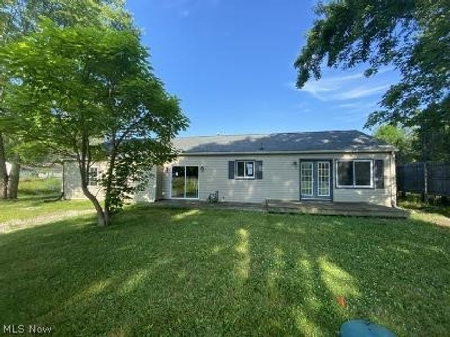 Cute 2 bedroom home has eat in kitchen with sliders leading to wooden patio, full bath, living room, family room and utility room.