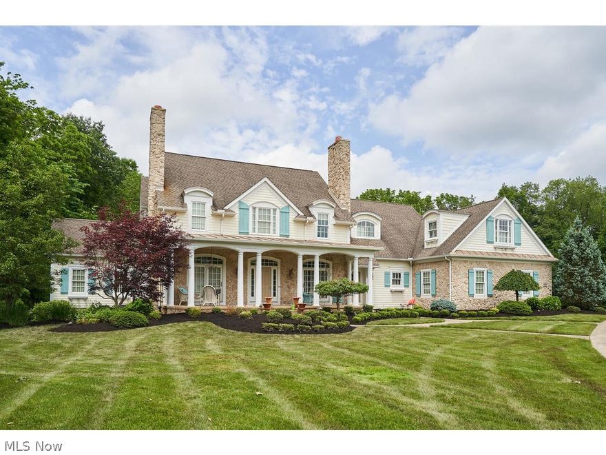 Custom built 5 bedroom, 6.5 bath Cottage style home on private 1.2 acre lot within the swim and tennis community of desirable Firestone Trace in Bath Twp. ALL NEW INTERIOR PAINT, CARPET THROUGHOUT, BRAND NEW LIGHT FIXTURES, & NEW KITCHEN BACKSPLASH!  LOOKS & FEELS LIKE A NEW HOUSE! This home is light, bright, open and cheerful. Chef's kitchen features white cabinetry, high end appliances, walk-in pantry, large island and breakfast bar and is open to hearth room with FP. 1st floor owner's suite with 2 walk-in closets and spacious bath. Mud room with cubbies, large laundry room and half bath complete the 1st floor. Entire 1st floor features hardwood floors. 2nd floor features 3 en-suite bedrooms, and an additional living suite, complete with its own kitchenette and laundry room. Front and back staircases. Finished, walkout lower level features Media room with stadium seating, Rec room with bar (including Kegerator), Exercise room and full bath. Enjoy miles of walking trails within the ne