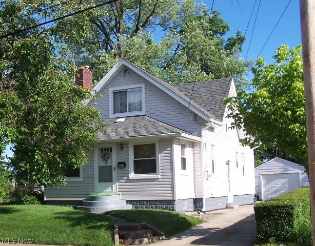 Darling home situated on a beautiful lot with no neighbors to rear of home, just neighboring properties maintained gardens. Many updates include 30 yr dimensional roof (2007), vinyl siding (2007), gutters with Gutter Guard (2007). Plumbing, furnace and central air all updated in the past 10 years, windows updated in 1990's and new garage door. This home will totally surprise you with 1st floor bedroom and bath, mud room, four seasons porch. The 12x16 with pergola is a wonderful addition for outdoor living space to enjoy your peaceful back yard. Recent recipient of Akron Beautification award for it's beautifully landscaped and well maintained yard.