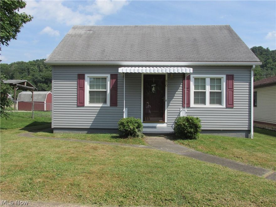 Completely furnished home, which has been kept really nice and updated, with attached garage and large covered carport.  Hardwood under carpet, all new electric throughout the house, and windows, clean dry basement with full bath, sun porch has a gas fireplace, plenty of storage and a great location.