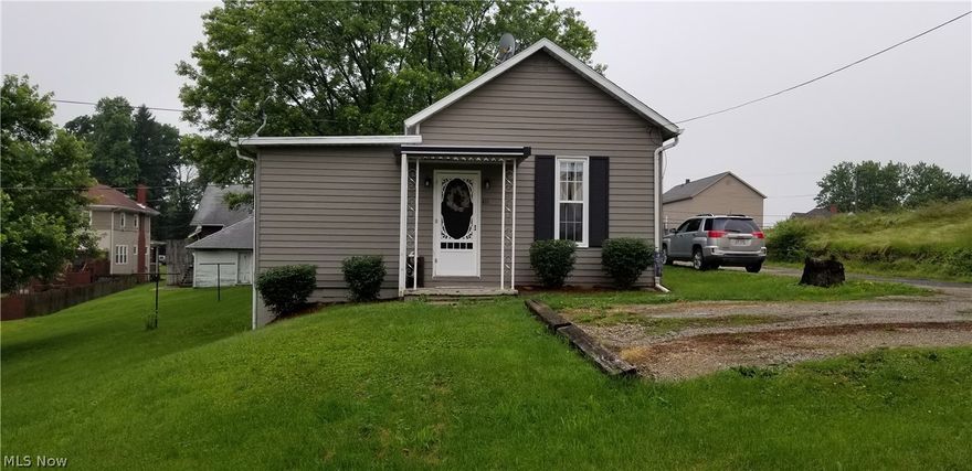 This adorable home is move in ready with beautiful hardwood floors & cozy rooms, located on a double, buildable corner lot.  Large eat in kitchen with stainless refrigerator and gas range. Welcoming covered front entry and nice size covered rear porch just off the kitchen for grilling and relaxing. Nice storage shed included.  Mineral rights convey.