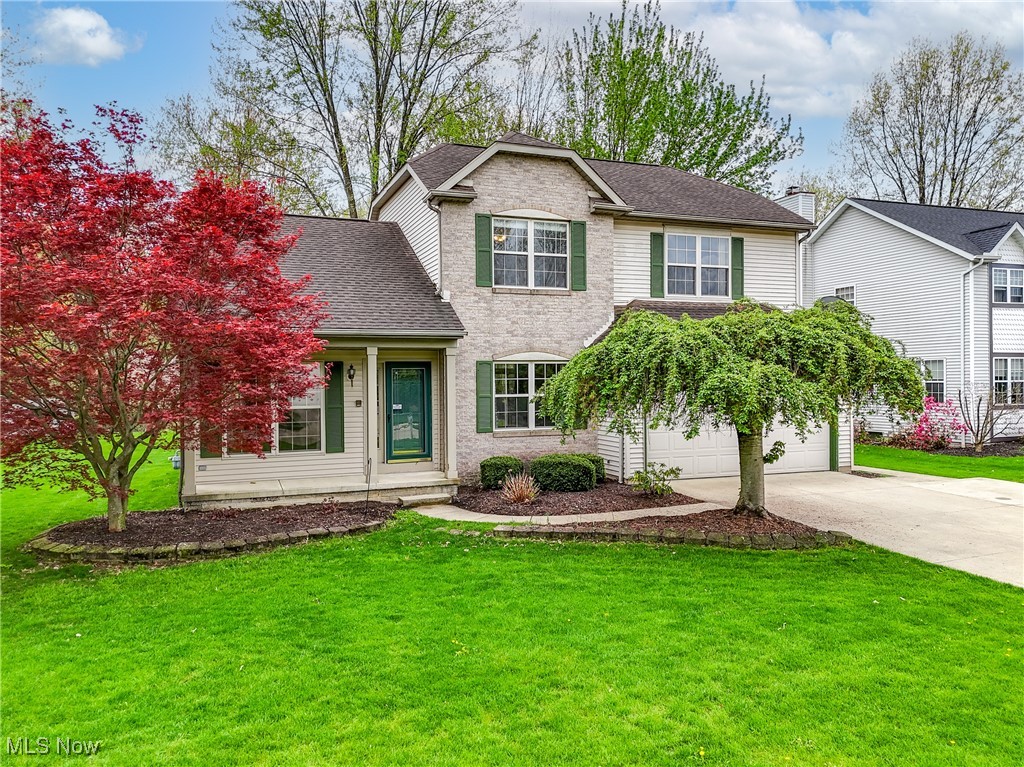 **Welcome to VILLAGES OF LAKESIDE - a sought after neighborhood in desirable Olmsted Township, served by the Olmsted Falls School District.** Step inside this beautifully updated open concept home where vaulted ceilings and abundant natural light create a bright and warm atmosphere. The spacious great room features an elegant fireplace as its focal point, while luxury vinyl flooring flows seamlessly throughout the main level. The stylish galley kitchen boasts timeless shaker-style cabinetry, stainless steel appliances, and a large window above the sink overlooking the peaceful green backyard space. Adjacent to the kitchen, a cozy dining nook with a charming coffee bar and rustic open shelving offers the perfect spot for morning routines and farmhouse-inspired decor. The separate formal dining room adds a touch of elegance with classic wainscoting with room to host friends and family. Upstairs, the spacious primary suite features everything you would expect: a walk-in closet and ensuite bath complete with double vanity and skylight. Two additional bedrooms and a full bath with double vanity provide plenty of space for family or guests.
The lower level offers a private 4th bedroom with its own full bath and closet plus a large finished bonus area - ideal for a home office, media room, playroom, or personal gym. A generous laundry/storage room adds functionality to this flexible layout. Step outside through your slider to enjoy your deep backyard and expansive stamped concrete patio - perfect for outdoor dining, entertaining, or relaxing evenings under the stars. An attached garage adds convenience year-round, especially during Cleveland's unpredictable weather. Don't miss your chance to own this warm and inviting home in one of the area's most sought-after communities. Schedule your private tour today!