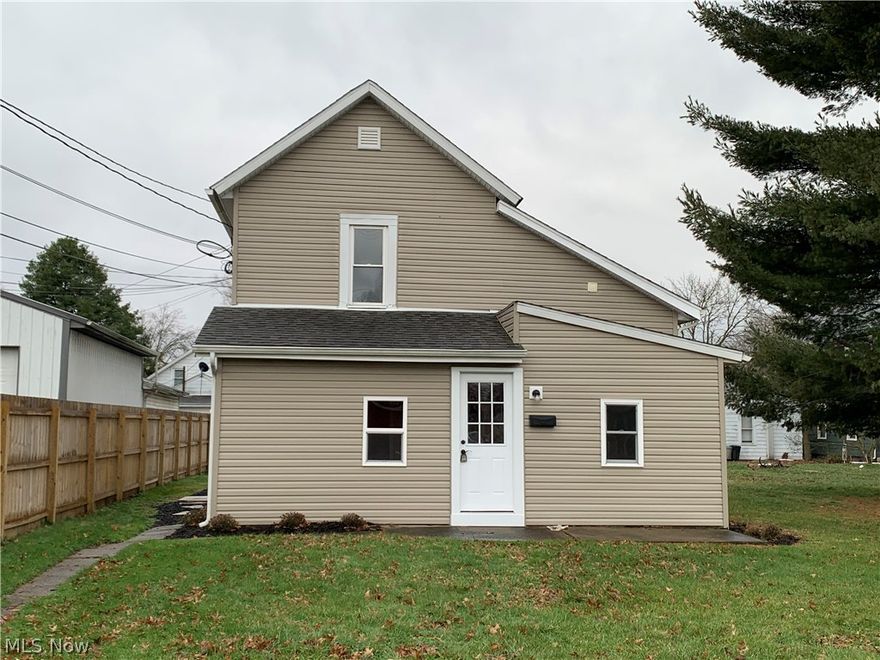 Beautifully remodeled home in move-in ready condition for under $100k! This home has 3 bedrooms, 2 full baths, a first floor laundry room and it sits on a 34x134 lot. There is a first floor master bedroom with a private bath and a walk in closet. The kitchen is equipped with a stove and refrigerator. Upstairs are the 2 additional bedrooms and the second full bath. Updates include vinyl siding, thermopane replacement windows, a new central air unit, new 100 amp electric, all new flooring and paint and so much more. The hot water tank is a rental. Immediate possession is available.