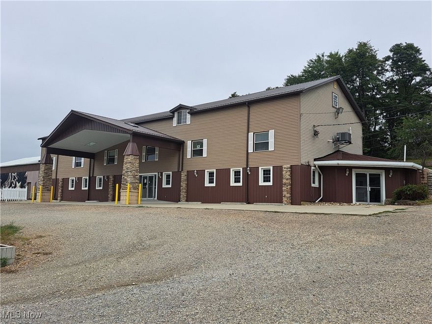 GREAT LOCATION for your existing or upcoming business!  Located on National Road (Rt. 40) just outside of St. Clairsville city limits. This commercial building offers a ground entrance with 7 private offices, a conference/meeting room, reception area 3 bathrooms and kitchenette for a total of 3500 sq. ft. for $3,800/mo. with ALL UTILITIES PAID (electric, water, sewer, heating, cooling, snow removal and trash).  NEED MORE SPACE?  You can lease another connecting 3,500 sq. ft. large conference rooms/showrooms/banquet rooms with more storage space for a total of $7,500/mo. ALL UTILITIES PAID!  **NEED EVEN MORE SPACE?  Check on lease price for a HUGE WAREHOUSE SPACE and/or HUGE GYM SPACE (perfect for a day care, fitness center, tumbling, or dance studio) with office and storage area, too!** Plenty of parking, signage available, no city income tax reporting required, traffic count approx. 10,000 vehicles/day.  This commercial space can be utilized for many types of businesses.  Call today for more details or to tour!