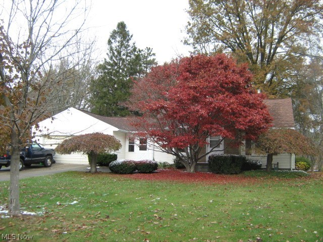 Remodeling has begun - add your finishing touches! Freshly painted, newly carpeted! Sliders from dining room & family room onto 13x19 deck overlooking big, treed backyard. Vinyl replacement windows, vented glass block basement windows. 2-car attached garage plus 1-car detached garage for storage. Knotty pine paneled 9x10 breezeway.