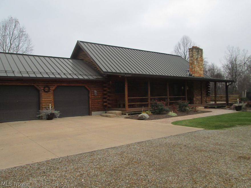 Secluded Log Home On 23. + Acres. Sandstone Fireplace. Large Wraparound Deck. Metal Standing Seam Roof. Master Bath With Whirlpool Tub.