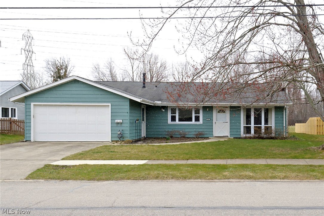 Don't miss this spacious ranch with many newer updates. The remodeled eat-in kitchen boasts newer cabinets, stainless steel double sinks, dishwasher, disposal, refrigerator and both a wall oven, microwave, and free standing gas range. Completely remodeled hall bath. Completely remodeled hallway laundry room with half bath (utility sink and toilet) • 19½'×14½' front family room with a walnut paneled wall, wood burning fireplace, adjustable bookshelves, and wood-look laminate flooring • 23'×13½' back living room with two ceiling fans/lights and 12' glass patio doors into a screened aluminum covered patio porch • 2009 gas water heater • Neat & clean move-in condition. Definitely worth a L@@K