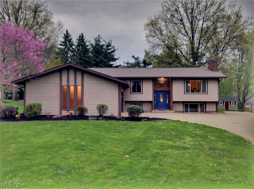 For peaceful mornings and sun soaked evenings all summer long, you'll be thinking this wonderful bi-level is checking just about every box there is. There are so many great things to love about this spot, including how open the interior feels. The main living space boasts vaulted ceilings with rustic beams and huge picture window to bring just enough of the outdoors in. The kitchen itself is all updated, clean, and comes with a center island. It connects easily to the dining room and attached sunroom, meaning entertaining will be a breeze. With a few good sized bedrooms on the main level, including the master suite with two closets and private bathroom, and a few more cozy bedrooms in the lower level, you'll have more than enough space for all the things and people you love. Trust us, the current family, two parents and five kids, have enough space to function beautifully. Downstairs is a perfectly sized family room with fireplace, full bath, mudroom, and laundry room. There's even som
