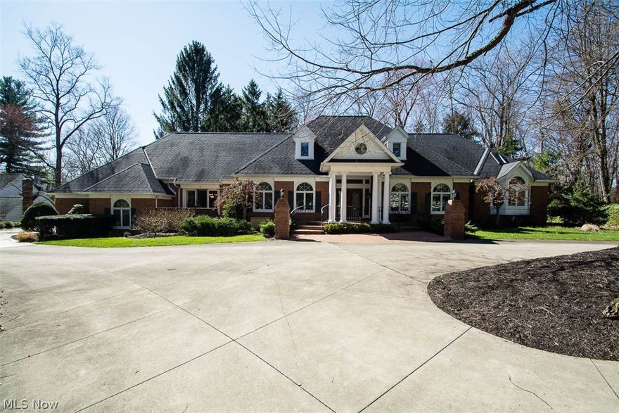 Welcome to this one owner, custom designed, quality built home nestled on 6.35 sprawling acres in Bath township. Drive up the driveway to the regal portico which offers a hint of what lies inside. Enter through the double glass doors to view the marble foyer which opens to a beautifully designed spiral staircase and views of the elegant living room. Three palladium windows, hardwood floors, a cathedral ceiling, and fireplace offer lovely vistas from the living room onto the deck and back yard. The first floor office is beautifully appointed with built-ins and has an adjacent gentleman's wet bar. The first floor master has a floor to ceiling bed with views of the private backyard, a fireplace, a master dressing area with his and her closets and a glamour bath with programmable shower. The gourmet kitchen features granite counters, Schrock cabinetry, a Sub-Zero refrigerator, Jenn-aire and a huge center island with a breakfast bar; it is open to the family room and to the morning breakfas
