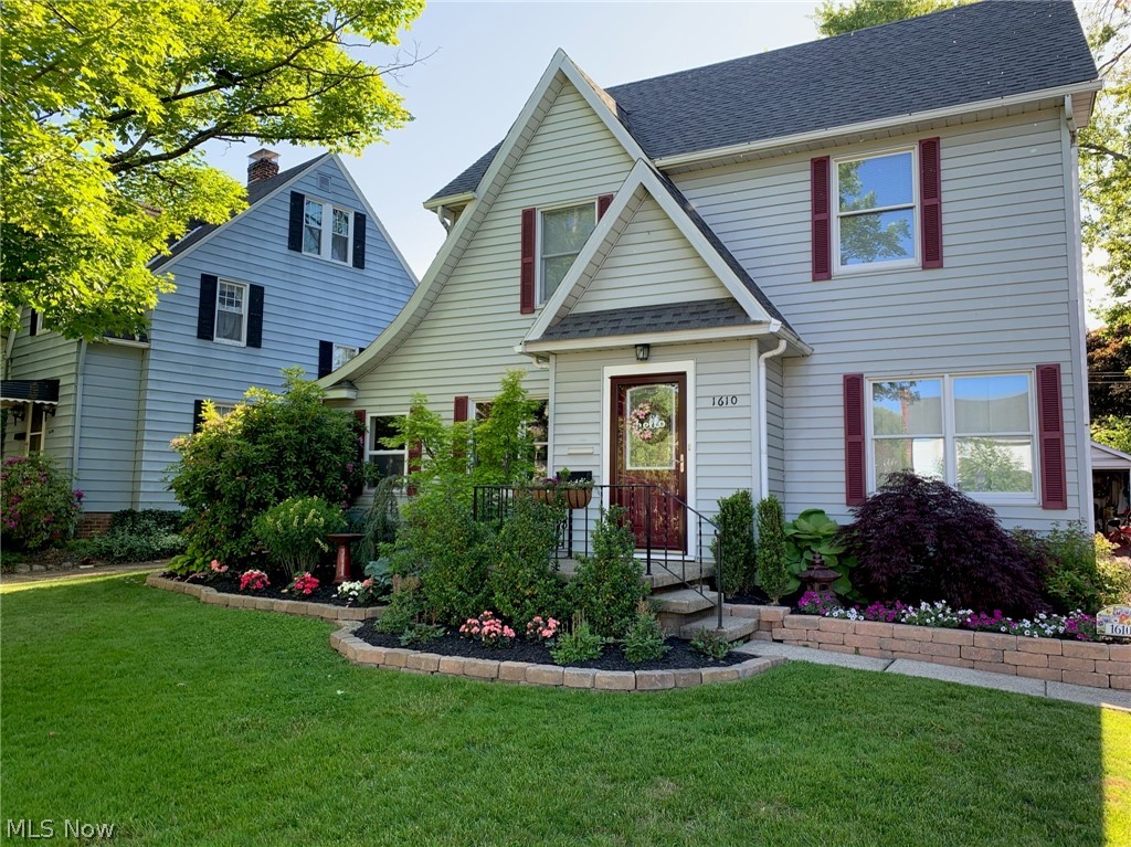 An absolutely stunning Cuyahoga Falls Colonial west of State Rd. With 4 bedrooms (one being the finished attic space) and 2 full baths, this almost 1800sq ft home is in immaculate condition. The old 1930 charm is kept with the natural wood floors, yet modern with an updated kitchen and baths. The large living room has a fireplace, and wood floors run throughout the living room and dining room. The updated kitchen has granite countertops. A library/office and an enclosed rear porch are also on the first floor. The second floor laundry coincides well with the nice sized bedrooms and 24x11 finished attic space with immaculate knotty pine. A wonderful rear patio, fenced back yard, 2 car garage, a full basement, and so much more.
