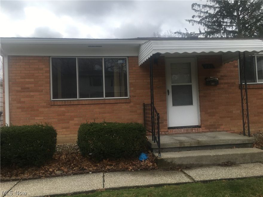 Ready to rent!  All the accommodations of convenience. GARAGE, BASEMENT, LAUNDRY HOOK UP, EAT IN KITCHEN, UPDATED DECOR IN BATHROOM AND KITCHEN! Ranch style apartment home has wood floors throughout the living and bedrooms. Neutral color paint throughout. The bedrooms have large closet spaces, the bathroom and kitchen have been updated. The kitchen has updated décor and equipped with a stove and refrigerator. The basement is shared but offers separate laundry hookups. Paved drive way with garage.