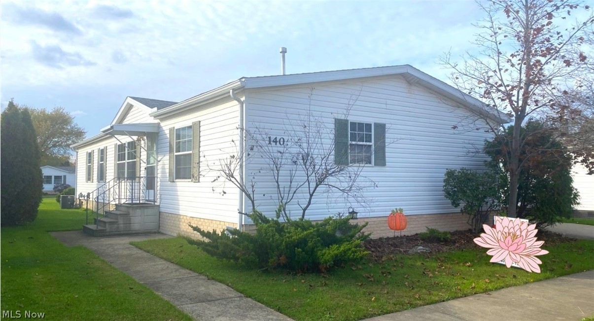 Welcome home to this sprawling four bedroom, two full bath updated and well maintained home in a quiet neighborhood near the heart of Amherst! Walk into this open floor plan and be greeted with beautiful dark laminate floors that run throughout the entire home (new subfloor as well)! Enter the modern and updated bright and light kitchen featuring a new SS stove (2020-currently electric but has option for gas), new fridge (2017), a breakfast bar, an abundance of white oak cabinets and LOTS of counter space! The living room features beautiful built-ins. Enjoy the views of the dining room through lovely french doors with built in blinds. The large owner's suite offer a spacious spa-like master bath with dual sinks, walk-in shower, and a corner soaking tub. Three additional bedrooms on the opposite end of the house all have new laminate flooring and large closets. The additional full bath features a recently updated vanity and a walk-in shower. A single door on the back leads to the covere