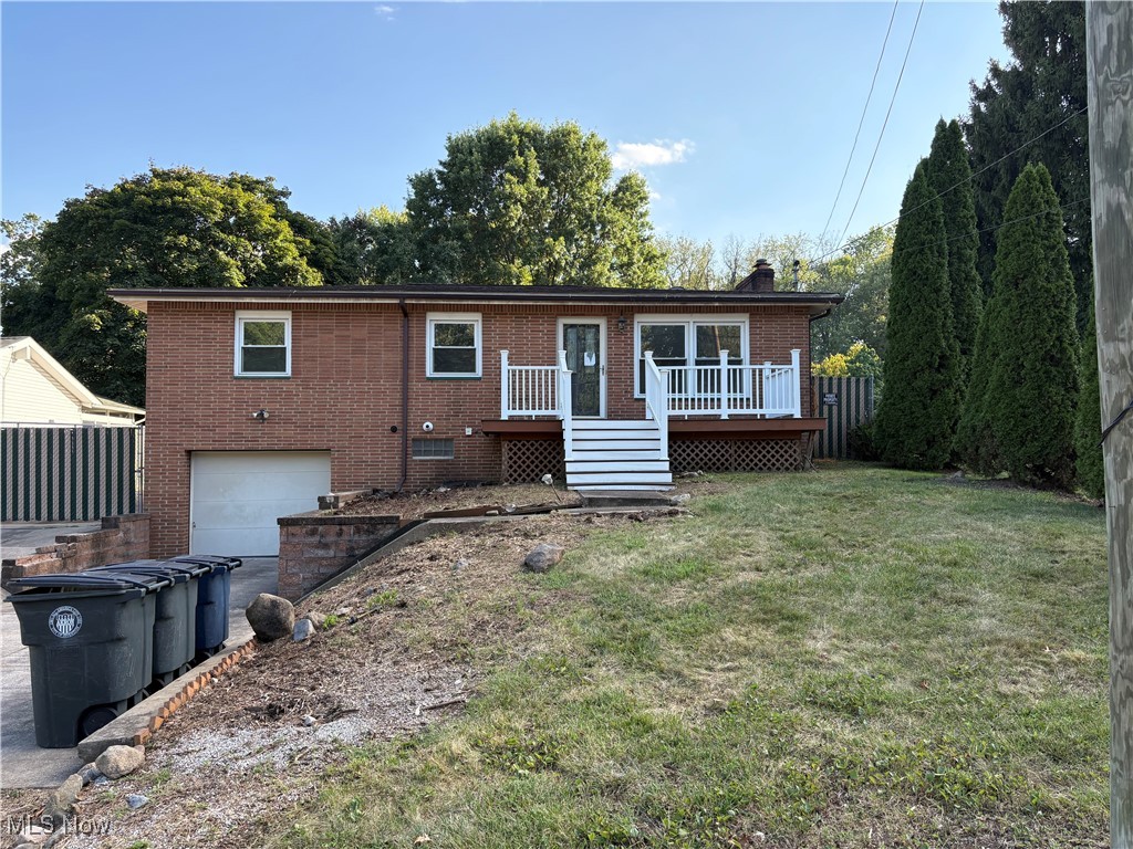 Charming brick ranch featuring three bedrooms, fully renovated. The residence encompasses roughly 2000 square feet. It includes a finished walkout basement that connects to the attached garage. Additionally, the basement offers the potential for a fourth bedroom and includes a fireplace. The property provides ample parking space, complemented by an extra detached garage. This home boasts both front and rear decks, along with a spacious backyard.