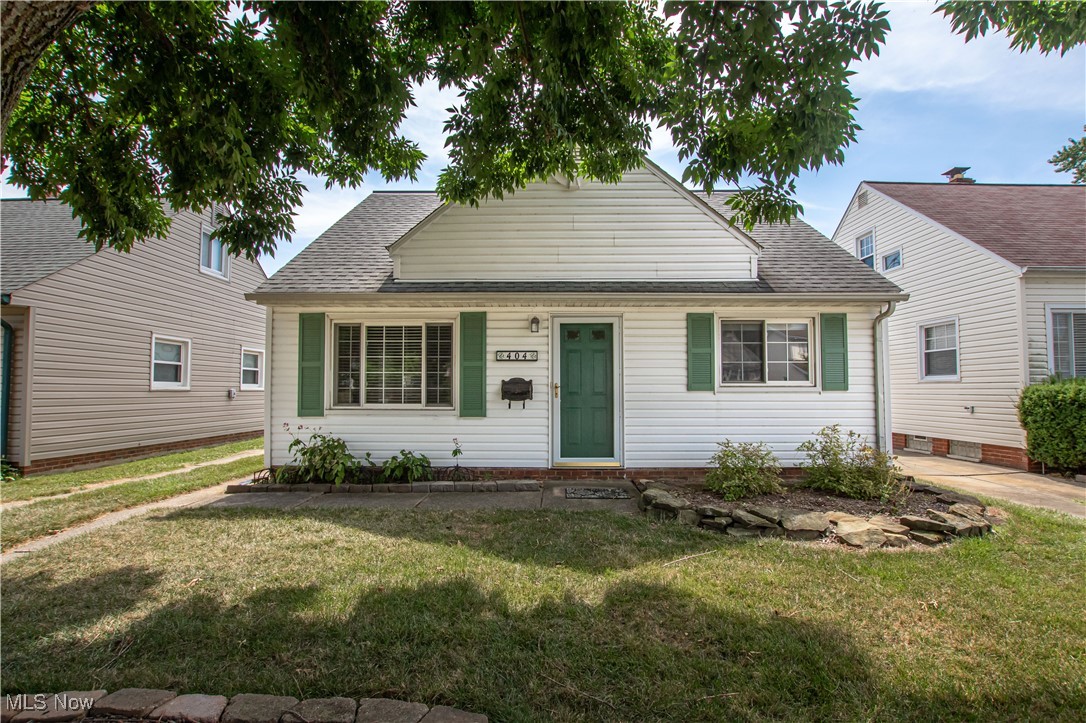 Welcome to this delightful 4-bedroom home in a sought-after park side neighborhood. Enjoy an efficient floor plan with seamless flow, beautiful hardwood floors, and plenty of natural light. The inviting living room features a large picture window. The eat-in kitchen boasts a subway tile backsplash, tile flooring, and a gas range. The first floor includes two bedrooms and an updated full bath with a stylish tile floor and modern lighting. Upstairs, you'll find two spacious bedrooms with generous storage and large windows that welcome a refreshing breeze and abundant sunlight. The wonderful fenced in backyard is perfect for entertaining, featuring a patio, retractable awning, flower beds, and walking paths. 1.5 car detached garage that will hold one car plus room for storage, lawn equipment, etc. Schedule your tour today!