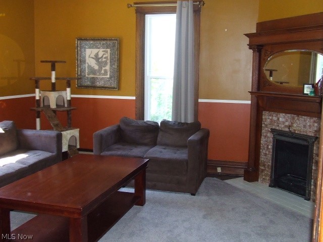 Beautiful Colonial with tons of Charm, waiting for your loving touches to bring it back to full glory!! Interesting first floor with lots of possibilities includes living room with beautiful, original, ornate tile and wood fireplace. There is a large dining room with built-in butler pantry and shelves, and a huge first floor bedroom. Charm abounds from the several sets of tall pocket doors with engraved hinges to the great, wide oak woodwork, stained glass window, and two-toned hardwood floors. The kitchen was previously updated with cherry cupboards and 2017 stainless steel appliances (dishwasher older). There is also a full bathroom on the first floor and an enclosed porch/mudroom. Upstairs are 3 more bedrooms, 2 with walk-in closets, and another full bathroom that was redone in 2018, including a soaker tub. There is a "bonus" room that previously was a 2nd kitchen, still has sink and small stove (disconnected), gas line still plumbed. There's also a large landing at top of st