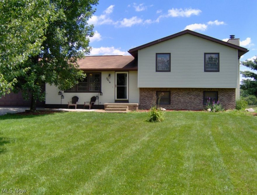 Beautiful 3 possible 4 bedroom, 2 full bath 4 level split. Living room, family room with wood burning fireplace, 32 x 40 outbuilding, 2 car attached garage, wrap around deck envelopes above ground pool. Winding concrete drive back to this 5 acre lot with private pond.