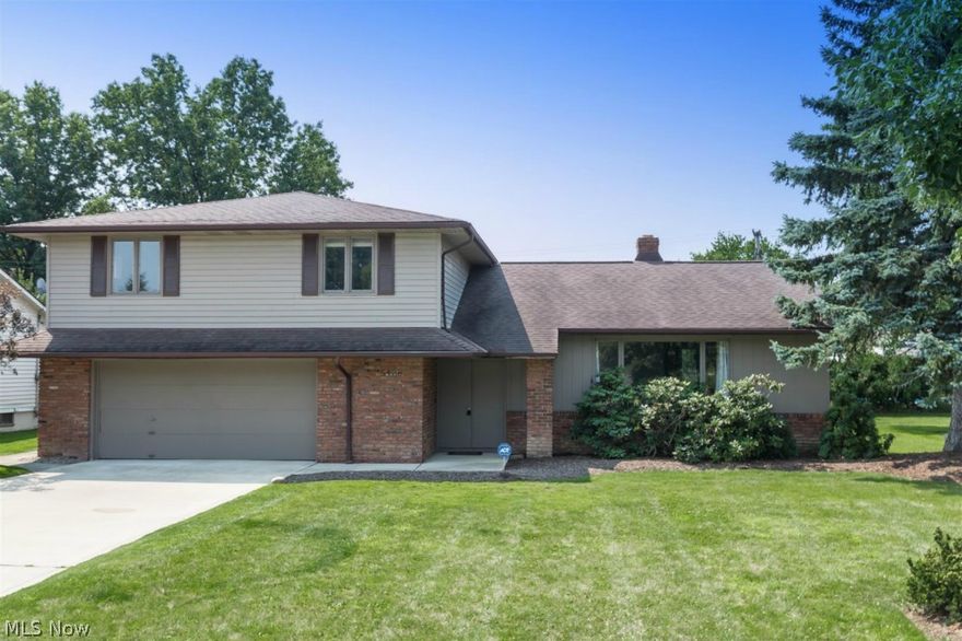 Complete remodeled 4 level split!  Gorgeous high end Kitchen remodeled with premium cabinetry, granite counter tops and ceramic tile flooring.  All stainless steel appliances stay!  Open floor plan with vaulted ceilings throughout!  Fresh paint colors, lend to the open and airy feel.  You will love the hard wood flooring throughout Living Room and Dining Room.  All Bedrooms are generous in size and closet space!  Master Suite is your private retreat with updated bathroom!  Newer furnace, central air, driveway, glass block windows!  Fresh, clean and shows like a dream!