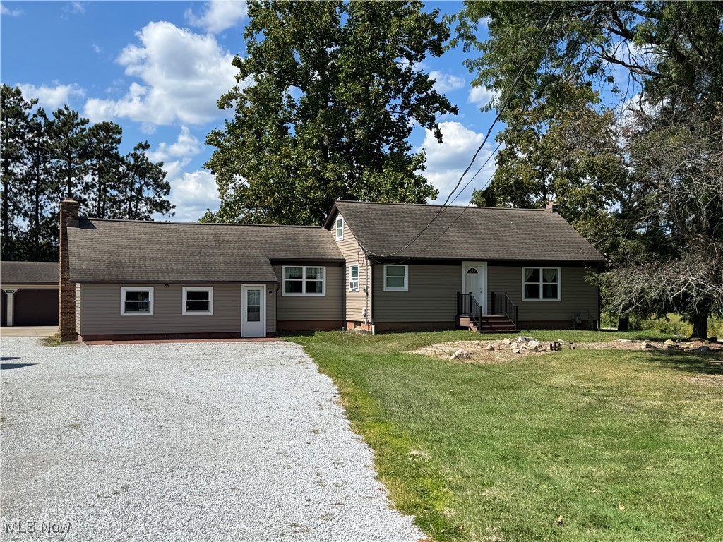 This charming three-bedroom ranch offers comfortable single-level living with thoughtful upgrades throughout. The home features a spacious layout, highlighted by a large living room that provides plenty of space for relaxing or entertaining. A formal dining room flows seamlessly from the kitchen, which is outfitted with modern granite counter-tops that add both style and durability.
A bright three-season room with soaring cathedral ceilings extends the living space and makes an ideal spot for morning coffee or evening gatherings. The home includes a full bathroom and three well-sized bedrooms, perfect for family, guests, or a home office.
One of the bedrooms is currently serving as a first floor laundry but can easily be converted back.
Outside, you’ll find a detached 32x24 garage with an additional 32x16 heated workshop—ideal for hobbyists, storage, or year-round projects. Altogether, this property combines practicality with charm, offering both inviting living areas and versatile work spaces.