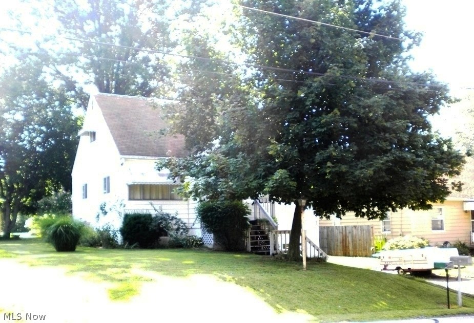 Perfect starter home @ a great new price in Portage Lakes! Solid home in need of someone to add their personal touch! Updates include new well-pump & water softener 2011 plus glass block & newer windows. Make any additional updates when you are ready, however, a little paint will make a difference until you are ready to get down and dusty. Convenient walk to Portage Lakes restaurant & Turkeyfoot Golf course! 3 bedrooms with possible 4th, part of the living room can easily be converted back to bedroom. 2 bedrooms 2nd floor, 1 with 2 single built-in beds with storage, 2nd room has 1 single built-in bed with lots of storage. Beautiful hardwood floors under carpet.