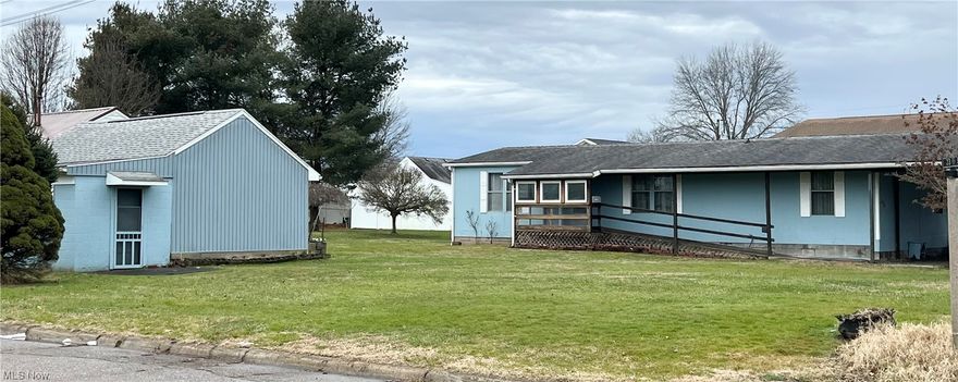 Fresh to the market we present this one floor living home in a location convenient to many restaurants and businesses with ramp access and semi enclosed front porch!  The high ceiling in the living room creates an open feeling that flows into the dining area.  The kitchen has a double door pantry providing space for many cooking essentials and supplies. Tying the dining and kitchen areas together is a barstool height counter.  Off the kitchen is a closet and laundry room with even more shelves.  All 3 bedrooms offer plenty of storage with double length closets.  The owner's suite even doubles that amount with closets on 2 walls as well as a large bathroom with separate tub and shower.   Outside you have a 2 stall carport attached to the home.   Even more parking options around the corner of the property at the detached garage with man door and manual garage door.  The garage is divided into two sides, making it perfect for a workshop.  One unique  feature of the property is the functioning antique hand water pump which draws from a well.  All of this on a large flat corner lot which offers opportunity for a garden or many other hobbies.  Schedule your own tour today!