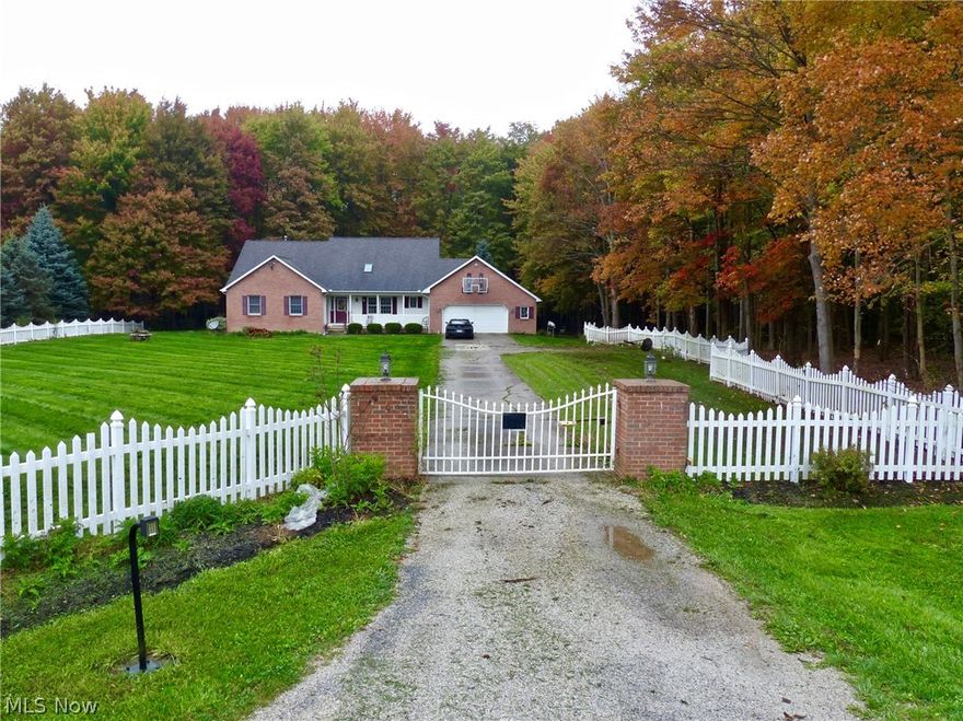 Beautiful Homestead on 22 acres (flag lot) with 65 x 36 Alum barn with 3 large access doors and 12' ceilings, Gated entrance to long private driveway to this Vinyl & brick ranch/cape with full basement and upper loft, Covered front porch, foyer entrance, Ceramic & white eat in kitchen with breakfast bar and appliances, Vaulted great room with gas fireplace, vaulted formal dining, first floor laundry plus half bath with washer/dryer and ceramic flooring, first floor vaulted master suite with private master bath offering: double sinks, steam shower, bidet, skylight and jetted tub, 2 other first floor bedrooms with ceiling fans plus another full bath, laminate flooring and 2 skylights in the 4-season sun room,  upstairs loft with skylight that overlooks the great room, 4th guest bedroom plus 12' walk in carpeted storage room, huge unfinished basement with glass block windows, fenced lot around the house, deck, Motorcross track and area Three (3) gas wells on property that service house, g
