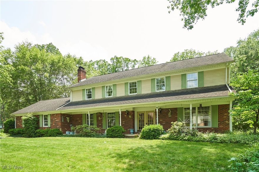 Welcome to the very first home built in Towpath Village! This 4/5 bedroom, 2.5-bath Colonial offers a fantastic opportunity to bring your vision and updates to a solidly built home with great bones. Enjoy peaceful moments on the large covered front porch or retreat to the serene backyard featuring a pergola, patio, gardens, and water feature. A 2-car garage provides added convenience. Community amenities include a pool, clubhouse, tennis and pickleball courts—perfect for active living. Ideally located with easy access to the Cuyahoga Valley National Park, Szalay's Farm, Blossom Music Center, and more. A rare find in a sought-after location!