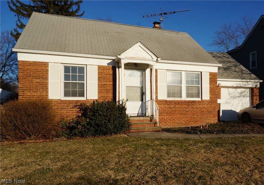 Gorgeous Brick Cape Cod with an Amazing 1st Floor Family Room Addition, Two Updated Full Baths on the 1st Floor, and a One car attached garage with double sided garage doors and a rear car port. ***Check out the 360 Degree Panoramic Virtual Tour!***  Updated Kitchen with Maple Cabinets. Hardwood Floors throughout the 1st Floor living space along with carpet in the family room addition.  The family room addition features a 2nd full bath, laundry area, vaulted ceilings with skylight, exposed wood beams, and french doors leading to the large private backyard.  Large Unfinished Basement can be finished for additional living space.  Call for your Private Showing Today!