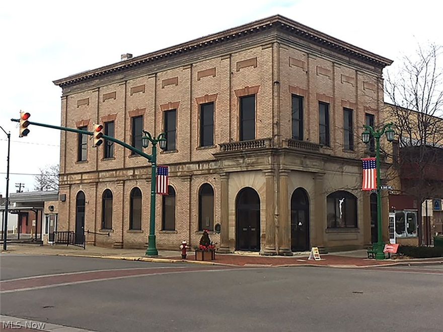 3,400-Sq.-Ft. Commercial Two-Story Stone & Brick Former Bank Building With Vault & Large Parking Area - Downtown Sebring, Ohio – 7% Seller Financing - ABSOLUTE AUCTION, this unique downtown building sells to the highest bidder on location: TUESDAY - JANUARY 9, 2018 – 12:00 PM - Quality built former bank building, two story, corner lot, ample parking. Covered drive-thru in rear – brick and stone construction with fancy stone columns, double set updated commercial entrance, large foyer with open main lobby, original bank vault, fancy trim and marble wainscoting, rear addition with drive-thru, 2nd level, large hall with several divided former offices – basement. Recent new Weil McLain modern gas fired boilers & central air on main level plus city utilities. 10 parcels. Ample parking. Adaptable to multitude of uses – better check it out. Maps and photos on website. TERMS ON REAL ESTATE: 10% down auction day, balance due at closing. A 10% buyer’s premium will be added to the highest bid to