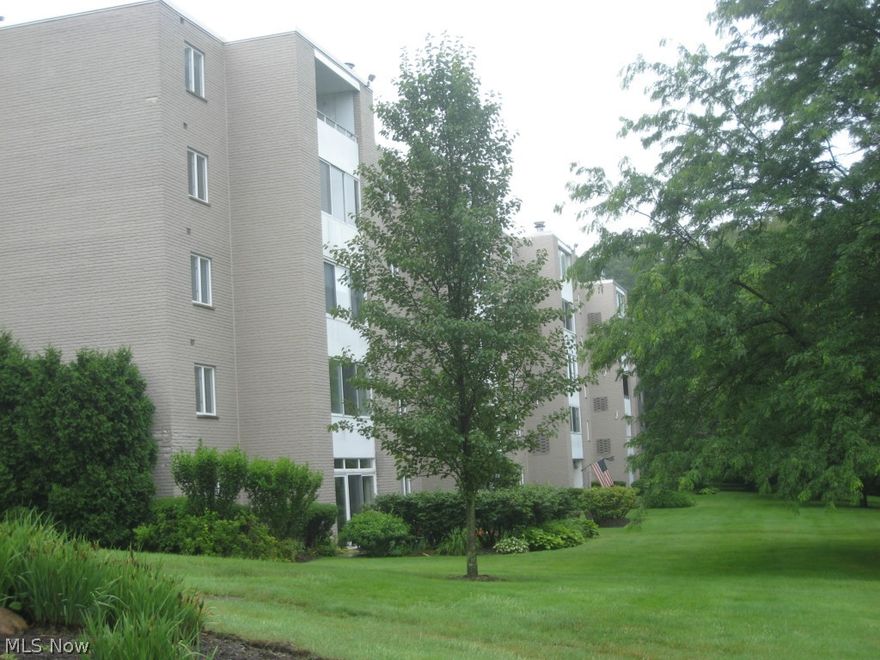 Nestled in the trees, this end unit overlooks the park on 2 sides.  Walk in to the foyer of this beautifully maintained unit that has been thoughtfully improved.  The seller wanted to take advantage of the end location and views of nature, so opened the porch and made it year round and open to the living room.  At the other end of the living room, made a cozy family room/office that could be a small bedroom.  Gorgeous cherry kitchen with lots of cabinet space and countertops.  Newer appliances, too!  Good size master bedroom with walk in closet.  In suite laundry with stacked washer/dryer combo stays.  Amenities include Community Room, Exercise Room, Library/Craft Room and pool.  All utitlities included except for sewer which is a quarterly bill. This is a secure building with inside parking.   This is a beauty.  Call to see.!