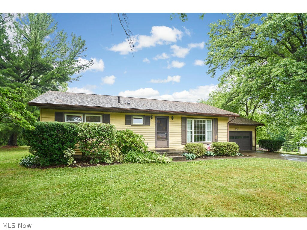 One owner for the last 65+ years…talk about pride of ownership! 3BR 1.5BA ranch on a secluded 1.5-acre lot in Bath township / Revere schools! Featuring an eat-in kitchen w/ dining area and slider to private rear deck (’22), spacious front living room (hardwood under carpet), 3 well-appointed bedrooms (one used currently as the 1st floor laundry), full bath, breezeway / mudroom to 2 car attached garage, and waterproofed partially finished basement with rec room & half bath! This home also hosts vinyl windows, gas furnace ’17, 200 amp electric ’15, plus the washer & dryer stay. Located nearly in the national park but minutes from Bath Nature Preserve / O'Neil Woods Metropark / Blossom Music Center, a 7-min drive to I-77/271, and a 10-min drive to Montrose/Fairlawn shopping and dining.