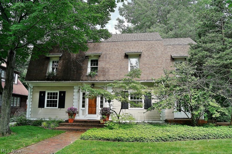 This Fabulous Home Is Not A Drive By!!!  Spacious colonial on extra-wide lot in one of Cleveland Heights’ most desirable neighborhoods. Light and bright rooms. Spacious, remodeled, true eat-in kitchen with granite counters, updated appliances, custom cabinets and newly refinished hardwood floors. Living room has marble-trimmed fireplace and adjoining sunroom with French doors to side yard. Formal dining room with built-in buffet. Master suite has marble-trimmed fireplace, 2 closets, and dressing room/office. Custom remodeled full bath on 2nd floor with double sinks, granite counter, and heated floor. Three finished rooms on 3rd floor plus updated full bath. Professional landscaping with two brick patios in back yard, great for entertaining. Many improvements throughout, including energy-efficient replacement windows, fresh interior paint, younger 2.5-car garage, and concrete driveway. Roxboro schools. Easy walk to Cedar-Fairmount shops and restaurants. Close to University Circle, CWRU,