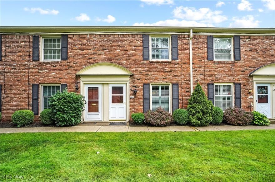 Adorable, updated 2-bedroom, 1-1/2 bath Condo with open floor plan and landscaped deck area. Large living room with engineered hardwood floors, eating area and kitchen with ceramic tile floor, kitchen with island, granite countertops, cherry cabinets, and stainless steel appliances that stay, including convection oven, fridge, dishwasher and microwave, and updated lighting. Also on first floor is a half bath with beadboard and brick walls, ceramic tile floor and pedestal sink, and also a coat closet with storage. At top of the stairs is a stack washer and dryer that stay, primary bedroom with double closet with sliding barn doors, second bedroom currently used as office/workout room. There's an updated full bathroom with step-in shower with glass doors and white subway tile, newer vanity with granite counter, and ceramic tile floor. Off the eating area are sliders that lead to covered deck and small brick patio, larger cement patio with landscaping and wood privacy fence.  There's an extra storage closet off the patio, plus a second closet with furnace and hot water tank.  Extras most of the condos don't have, built-in cabinet/pillar separating living room from dining area, linen closet outside the main bath, spigot for watering plants in the furnace closet and extensive landscaping with the covered deck. Updates include furn 2022, C/A 2017, carpet in bedrooms & stairs 2021, engineered hardwood in living room 2021, main bathroom 2021 including shower/vanity/toilet/floor/subway tile, kitchen appliances 2024, electric box 2020 with surge protection, new interior Alder wood doors and closet barn doors 2021 (left unstained, in natural state), unit repainted within past 2 years, all newer windows, plantation shutters. Home warranty included. There are two walkways from parking lot and assigned spot to front and back entrances, plus several visitor spots. Nothing for you to do but move in and enjoy the assoc. pool and tennis/pickleball courts. Make your appointment today!