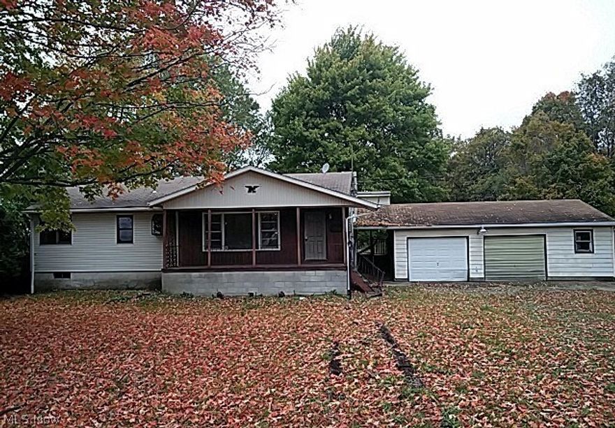 MUST SEE!! This spacious ranch features 3 bedrooms; 2.5 baths.  Cozy living room offers large picture window to allow the natural light in.  Kitchen offers an abundance of cabinetry and counter space plus and eat in area.  Full basement for extra storage.  2 car attached garage.  Over 1/2 acre of land, great for entertaining or gardening.  Covered front porch to relax on during the warmer months - plus a wrap around deck in the back.  Bring your decorating ideas and make this your home.  Schedule your showing Today!! Cash or Rehab Loan.