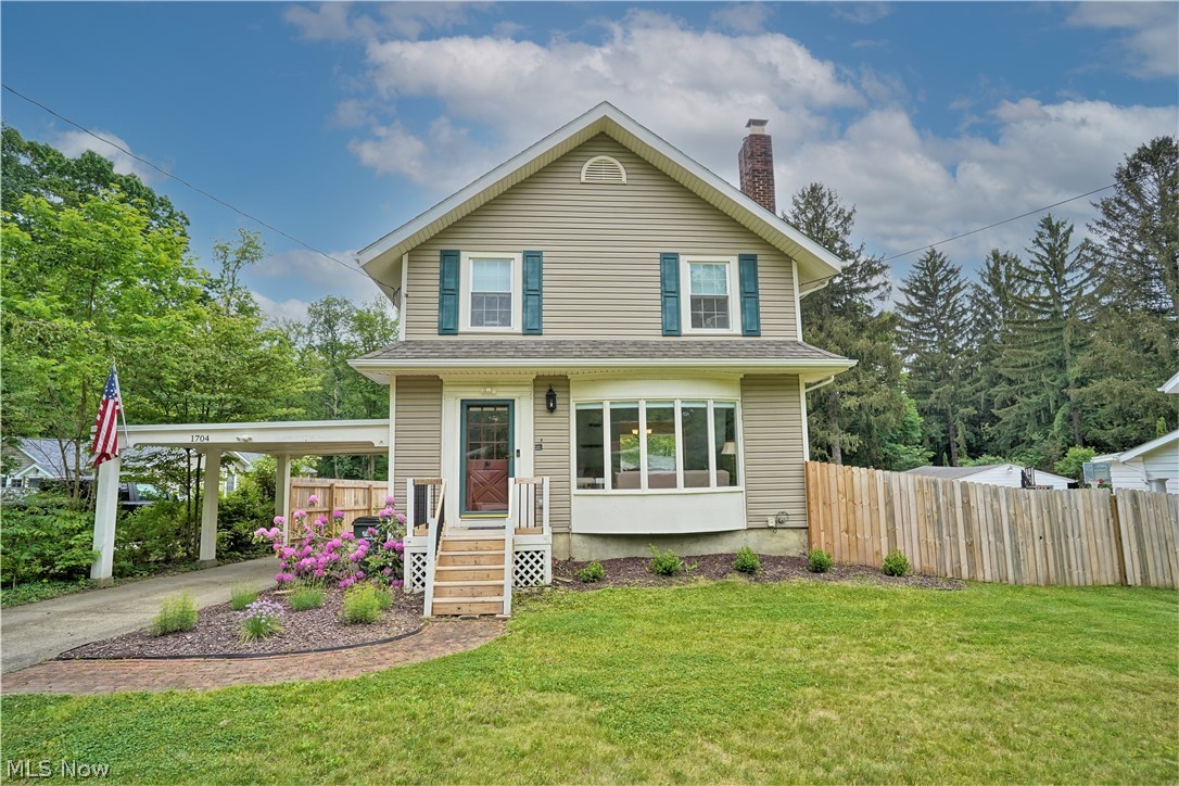 Absolutely charming colonial with an amazing covered deck and private .86 acre backyard that backs up to the park and is fenced in. Spacious living room features beams, built-ins, wood burning fireplace, bay window, and beautiful hardwood flooring. The dining room also features built-in's and is open to the kitchen complete with an island and access to the back deck. The bedrooms are good size and there's even a finished attic - perfect for a bonus room. The finished lower level includes a bar area, a large rec room, and an additional full bathroom. Updates include: A/C - 2020, fence, gutters w/ guards, patio, and carport roof - 2019, hot water tank - 2017, and the hardwood floors were refinished in 2016. Two car garage plus a carport. Walking distance to restaurants and shopping.