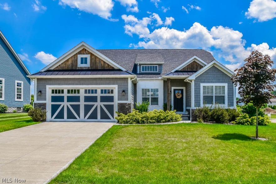 Better than new 3 bedroom, 3 full bath ranch with a finished lower level in Shepherd’s Gate! Incredible curb appeal with stone and vinyl shake siding, situated on a corner lot at the end of a cul de sac. Inside, admire the open floor plan with high ceilings, hardwood floors, beautiful trim, doors and doorknobs! Find your culinary inspiration in the open kitchen boasting stainless steel appliances, granite counters, soft-close cabinetry and a center island with bar seating and a farm apron sink. Enjoy meals in the casual dinette with a sliding door to the back porch or in the formal dining room with columns, archways and crown molding. Gather in the spacious great room with a beautiful coffered ceiling and a gas stone fireplace with a barn beam mantle. Split bedroom design to give the master suite optimal privacy. The master has custom ceiling work, a walk-in closet and a master bath with dual sinks, granite, a freestanding tub and shower. 2 additional bedrooms and a full bath with tile