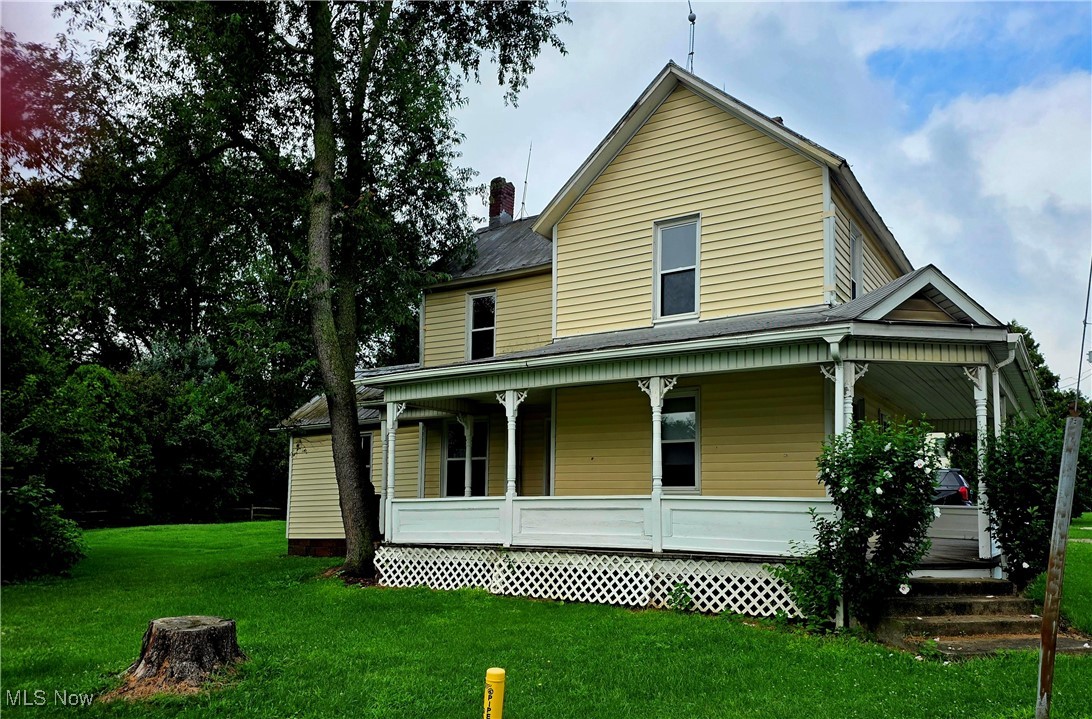 Welcome to this delightful 3-bedroom, 1-bathroom home offering a blend of classic charm and functional space. The main floor features an open kitchen and living room area. You will also find a bedroom or office space. Upstairs you'll find a full bathroom and 2 nicely sized bedrooms. Step outside and enjoy sitting on the large wrap around porch. The expansive lot has endless possibilities and features a large outbuilding. Don't miss your chance to own a property with endless possibilities!!